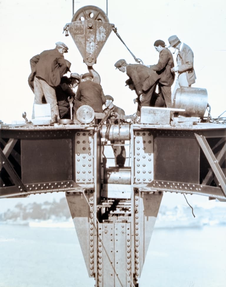 Archival workers assembling the Sydney Harbour Bridge