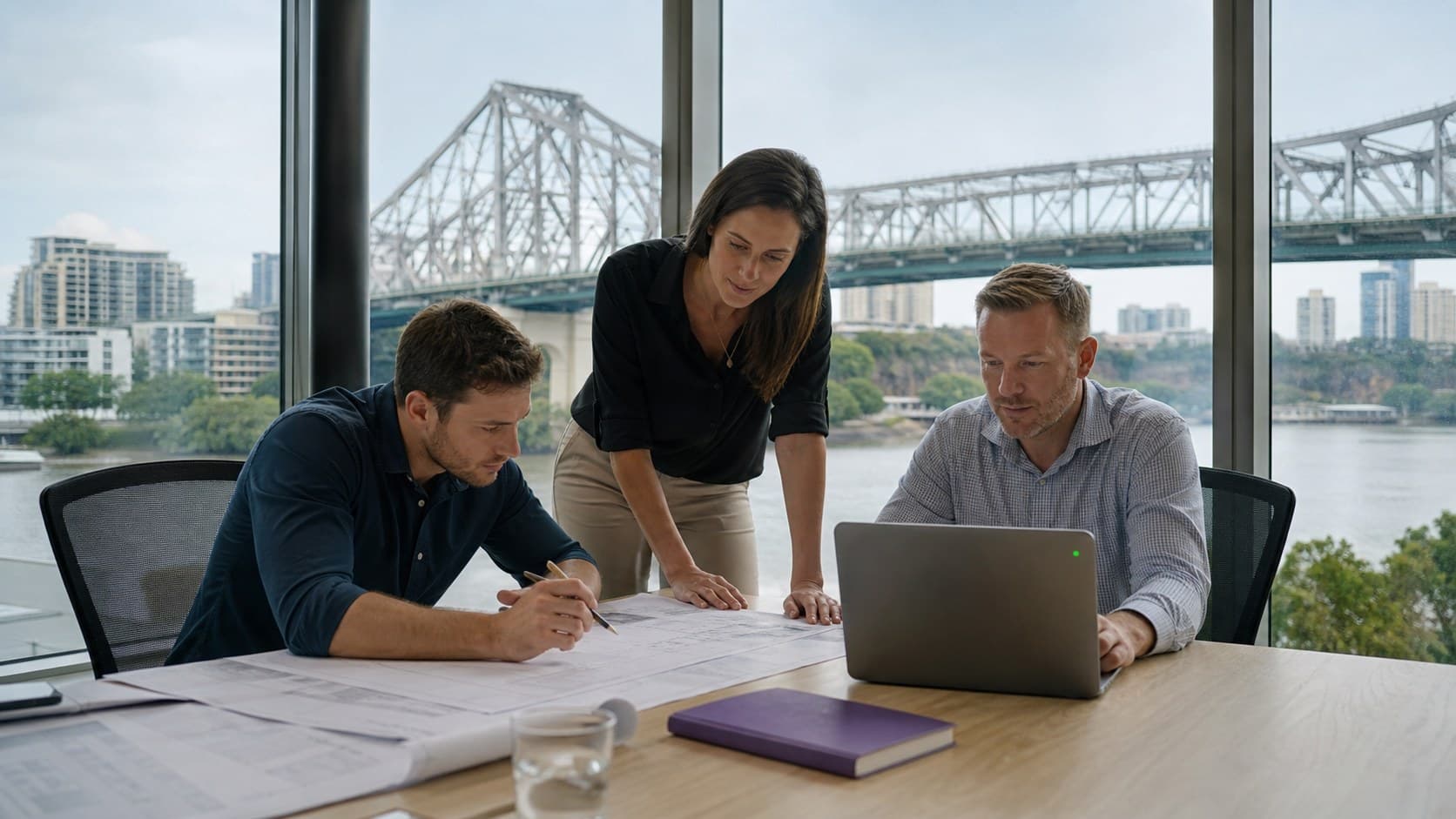 A consultant drafting technical plans at a desk